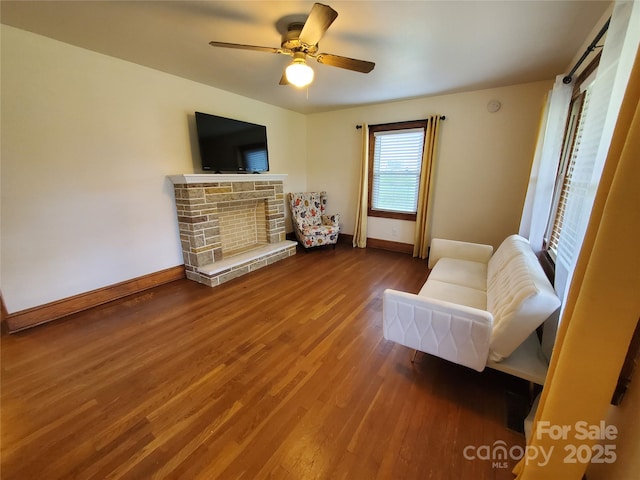 3558 Sunset Grill St, Connelly Springs, NC 28612 - living room featuring wood finished floors, ceiling fan, and a stone fireplace