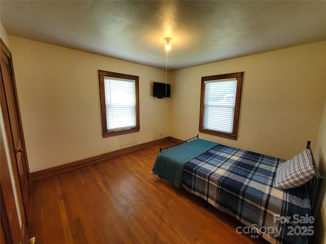 3558 Sunset Grill St, Connelly Springs, NC 28612 - bedroom featuring multiple windows and wood finished floors