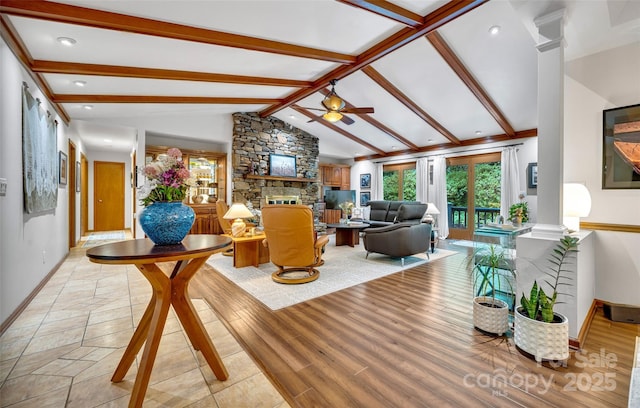 23 Indigo Way, Hendersonville, NC 28739 - living room with a stone fireplace, ornate columns, ceiling fan, recessed lighting, and light wood-type flooring