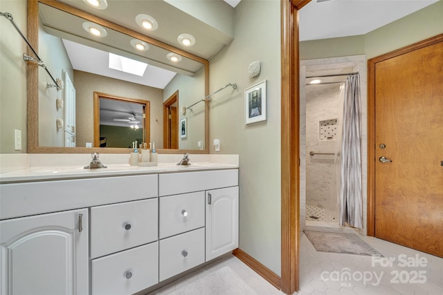 23 Indigo Way, Hendersonville, NC 28739 - full bath with double vanity, a shower stall, a skylight, tile patterned floors, and a ceiling fan