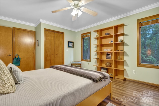 23 Indigo Way, Hendersonville, NC 28739 - bedroom with wood finished floors, ornamental molding, and ceiling fan