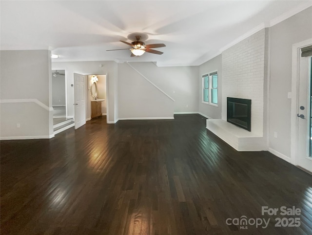 27 Quayside Ct, Clover, SC 29710 - unfurnished living room with ceiling fan, dark wood-type flooring, a brick fireplace, and stairway