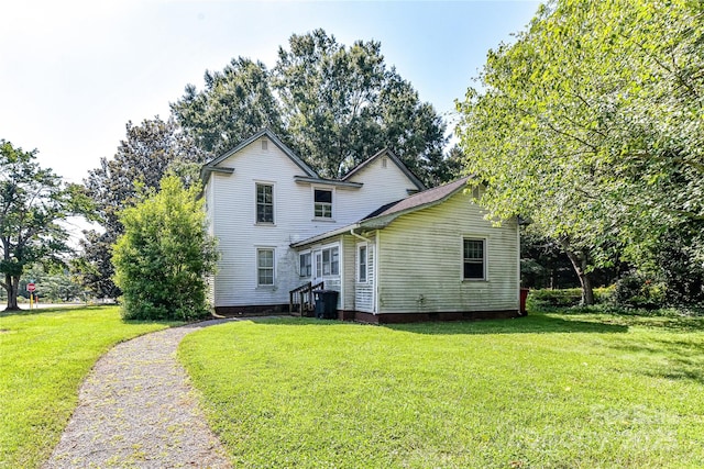 504 Potts St, Davidson, NC 28036 - rear view of house featuring a yard