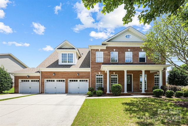 646 Quicksilver Trl Unit 183, Fort Mill, SC 29708 - view of front of home featuring a garage, brick siding, driveway, a front yard, and covered porch