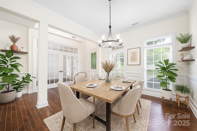 646 Quicksilver Trl Unit 183, Fort Mill, SC 29708 - dining area featuring dark wood-style floors, a chandelier, french doors, ornamental molding, and a wainscoted wall