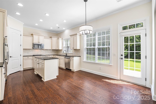 646 Quicksilver Trl Unit 183, Fort Mill, SC 29708 - kitchen featuring appliances with stainless steel finishes, crown molding, dark countertops, decorative backsplash, and dark wood-style flooring