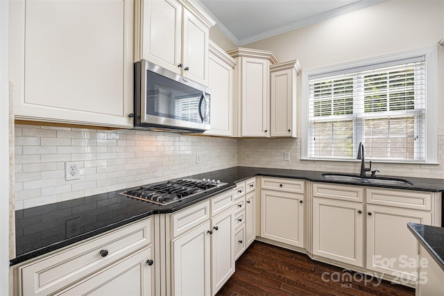 646 Quicksilver Trl Unit 183, Fort Mill, SC 29708 - kitchen with stainless steel appliances, dark countertops, crown molding, dark wood-style floors, and tasteful backsplash