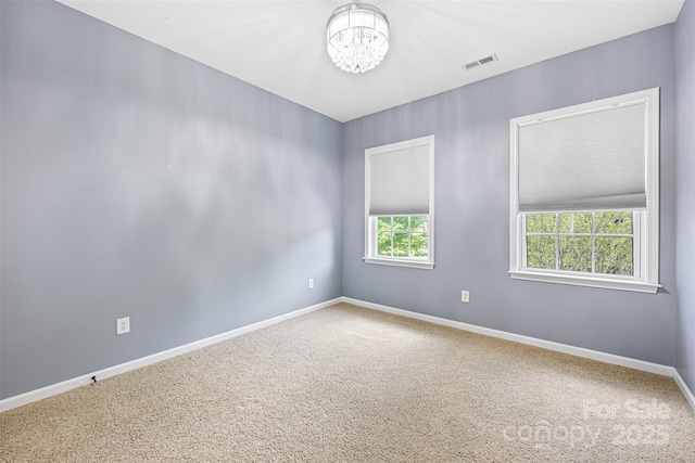 646 Quicksilver Trl Unit 183, Fort Mill, SC 29708 - carpeted spare room with a chandelier and baseboards