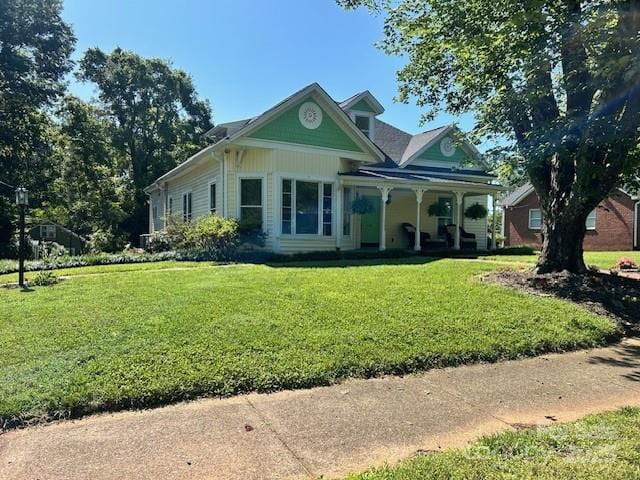 743 S College Ave, Newton, NC 28658 - victorian house with a porch and a front yard