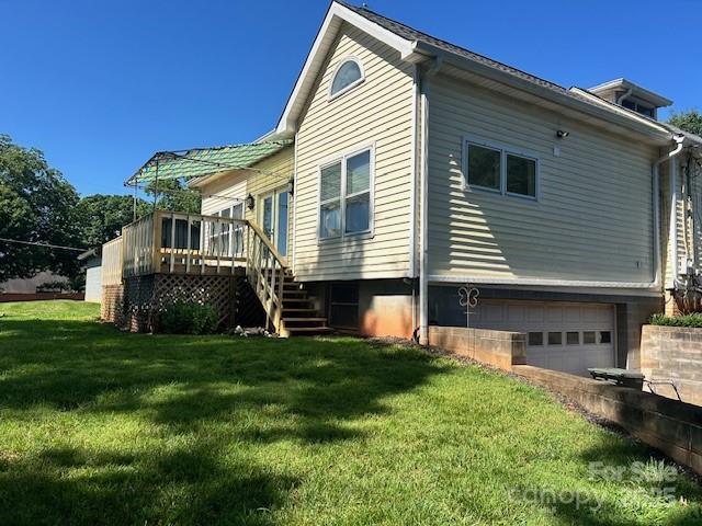 743 S College Ave, Newton, NC 28658 - view of property exterior with a garage, stairs, a deck, and a yard