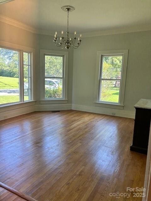 743 S College Ave, Newton, NC 28658 - unfurnished dining area with a chandelier, crown molding, and wood finished floors