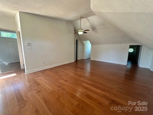 743 S College Ave, Newton, NC 28658 - additional living space featuring a textured ceiling, wood finished floors, vaulted ceiling, and ceiling fan