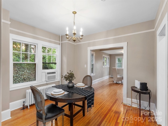 50 Skyland Ter, Canton, NC 28716 - dining space with a chandelier, light wood-type flooring, cooling unit, and radiator heating unit