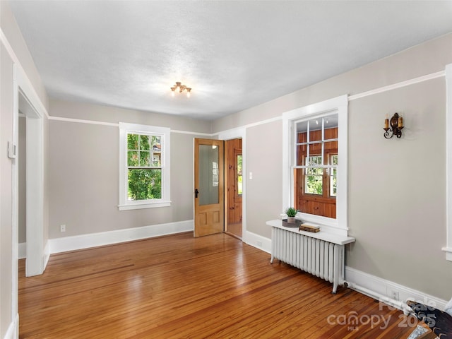 50 Skyland Ter, Canton, NC 28716 - spare room featuring radiator heating unit and hardwood / wood-style floors