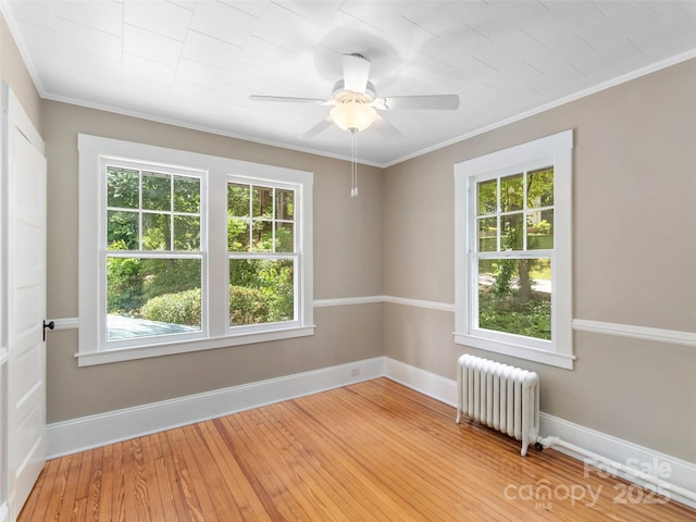 50 Skyland Ter, Canton, NC 28716 - empty room featuring radiator, plenty of natural light, crown molding, a ceiling fan, and wood finished floors