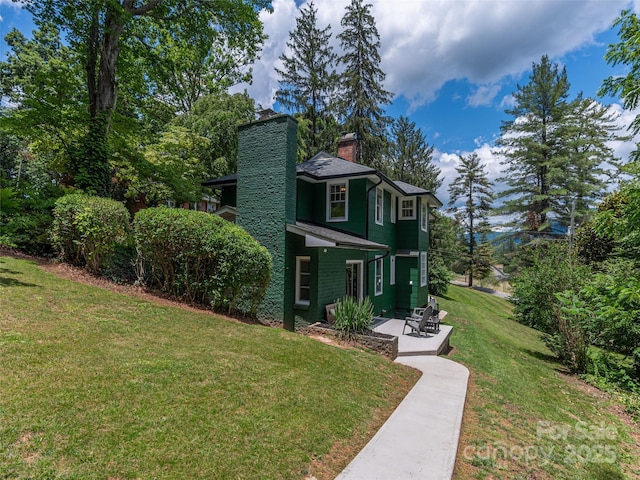 50 Skyland Ter, Canton, NC 28716 - view of front facade featuring a chimney, a front lawn, a patio, and roof with shingles
