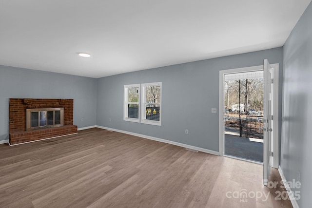 1229 Jenkins St, Rock Hill, SC 29732 - unfurnished living room with wood finished floors and a fireplace