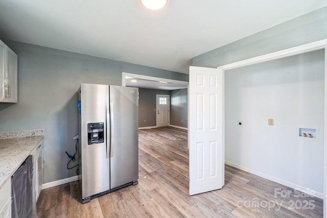 1229 Jenkins St, Rock Hill, SC 29732 - kitchen featuring stainless steel fridge with ice dispenser, light wood-type flooring, and light stone counters