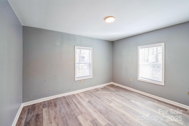 1229 Jenkins St, Rock Hill, SC 29732 - spare room featuring plenty of natural light and wood finished floors