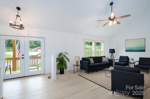 1036 Williamsburg Dr, Lenoir, NC 28645 - living room featuring french doors, wood finished floors, ceiling fan, high vaulted ceiling, and a chandelier