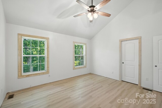 1036 Williamsburg Dr, Lenoir, NC 28645 - spare room with wood finished floors, healthy amount of natural light, a ceiling fan, and high vaulted ceiling