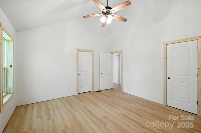1036 Williamsburg Dr, Lenoir, NC 28645 - unfurnished bedroom featuring wood finished floors and high vaulted ceiling