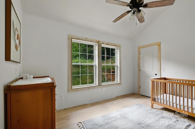 1036 Williamsburg Dr, Lenoir, NC 28645 - bedroom featuring light wood finished floors, vaulted ceiling, and a crib