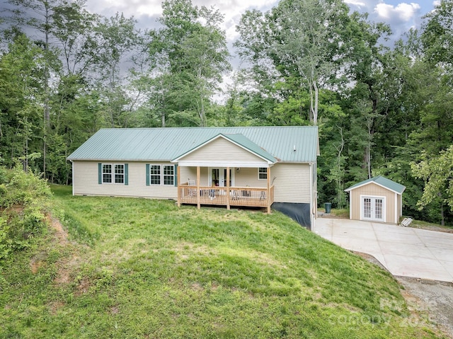 1036 Williamsburg Dr, Lenoir, NC 28645 - ranch-style home with french doors, a front yard, a metal roof, and a wooden deck