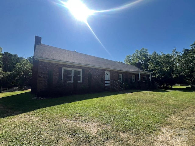 2437 Knox Station Rd, Chester, SC 29706 - view of front facade featuring brick siding, a front yard, and a chimney