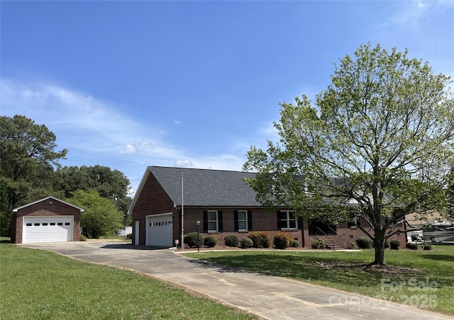 2515 Myra Ln, Lincolnton, NC 28092 - view of front facade featuring a front yard, brick siding, and a detached garage