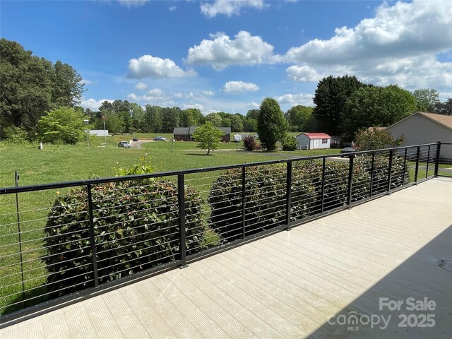 2515 Myra Ln, Lincolnton, NC 28092 - wooden deck featuring a lawn and view of wooded area
