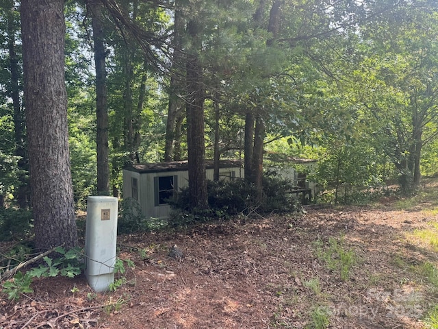 1290 Gardiol Ave NE, Valdese, NC 28690 - view of front of home with a forest view