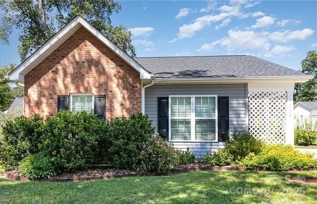 1114 Cason St Unit 6, Belmont, NC 28012 - view of front of property featuring a front yard, brick siding, and a shingled roof
