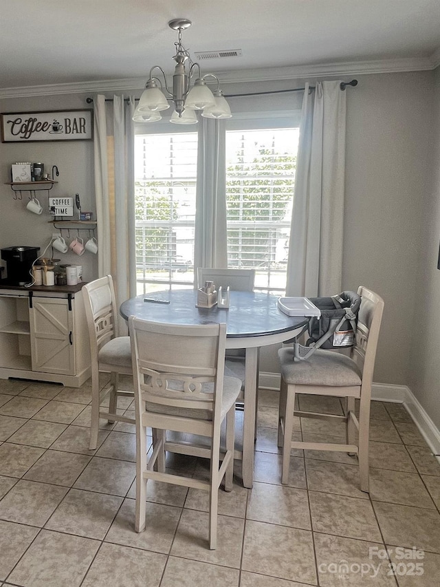 1114 Cason St Unit 6, Belmont, NC 28012 - dining space with crown molding, a chandelier, and light tile patterned flooring