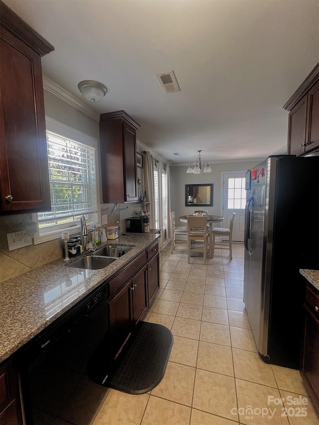 1114 Cason St Unit 6, Belmont, NC 28012 - kitchen with freestanding refrigerator, black dishwasher, crown molding, light tile patterned floors, and dark brown cabinets