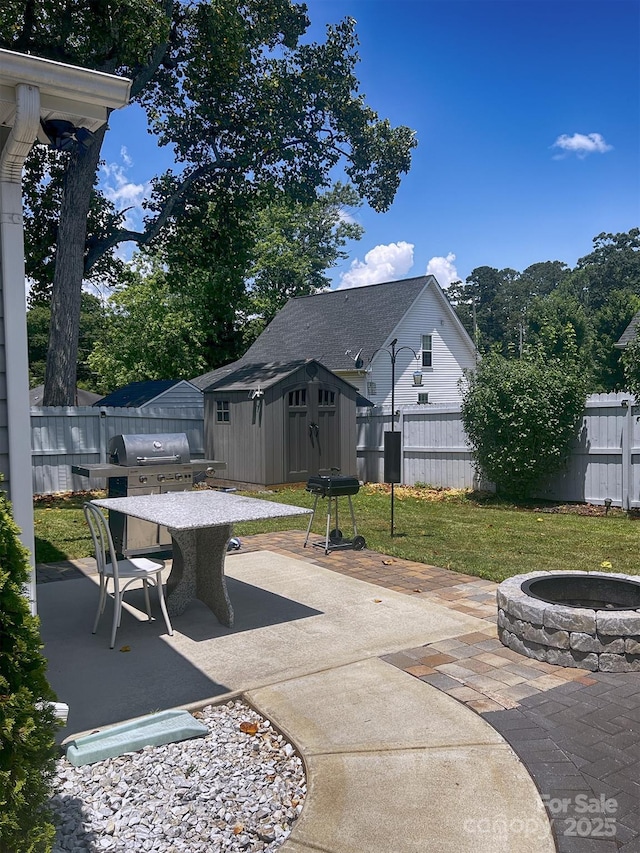 1114 Cason St Unit 6, Belmont, NC 28012 - fenced backyard with an outdoor fire pit, outdoor dining space, a storage shed, a patio area, and a grill