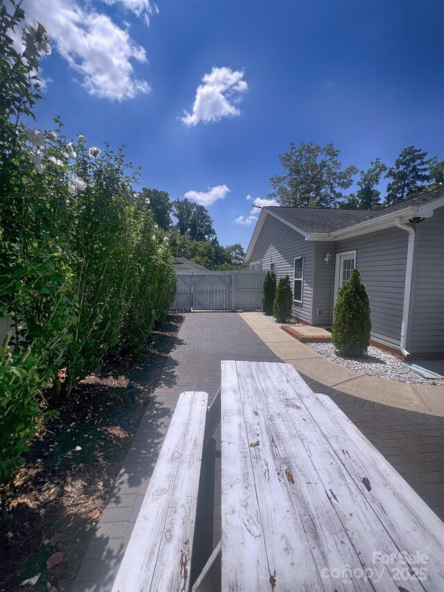 1114 Cason St Unit 6, Belmont, NC 28012 - wooden terrace with a gate and a patio