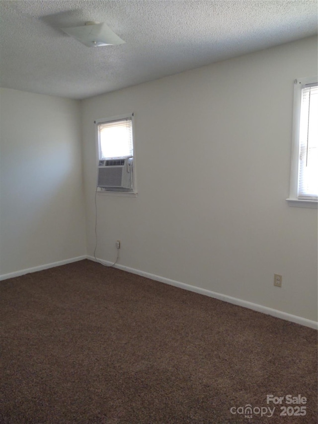 2100 Airport Rd, Salisbury, NC 28147 - carpeted empty room featuring cooling unit, healthy amount of natural light, and a textured ceiling