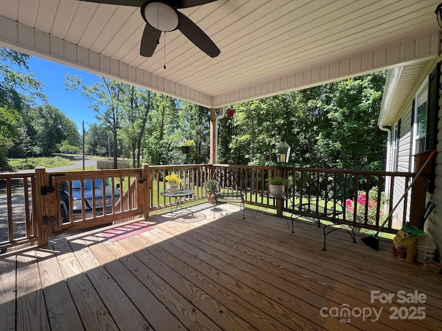 5550 Hillsdale St, Fort Lawn, SC 29714 - wooden deck featuring ceiling fan and view of wooded area
