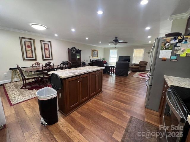 5550 Hillsdale St, Fort Lawn, SC 29714 - kitchen with ceiling fan, ornamental molding, stove, open floor plan, and a kitchen island