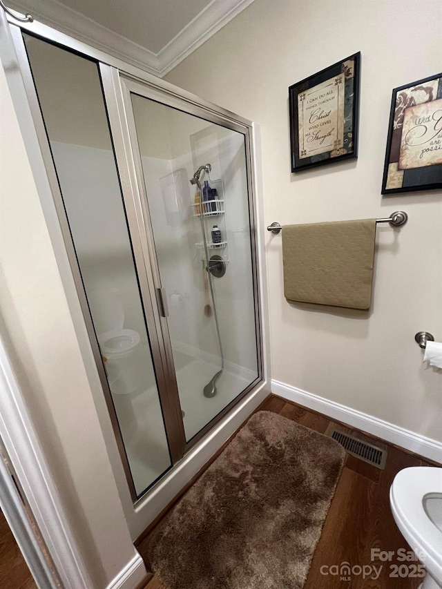 5550 Hillsdale St, Fort Lawn, SC 29714 - bathroom with ornamental molding, a stall shower, and wood finished floors