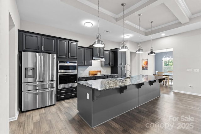 18568 Mainsail Ct, Lancaster, SC 29720 - kitchen with stainless steel appliances, a kitchen bar, stone counters, ornamental molding, and backsplash