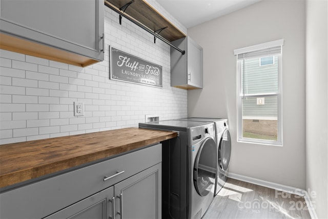 18568 Mainsail Ct, Lancaster, SC 29720 - laundry area with cabinet space, washing machine and dryer, and wood finished floors