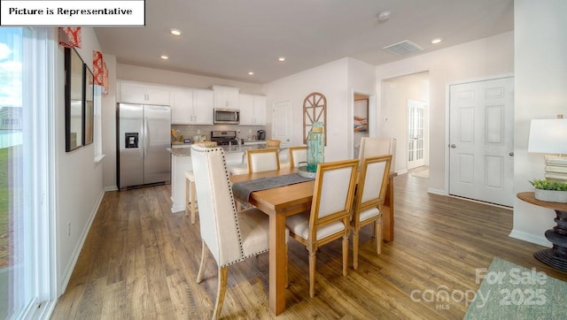 119 Rustling Waters Dr, Mooresville, NC 28117 - dining area featuring dark wood-style flooring and recessed lighting