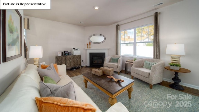 119 Rustling Waters Dr, Mooresville, NC 28117 - living room with wood finished floors, a fireplace with flush hearth, and recessed lighting