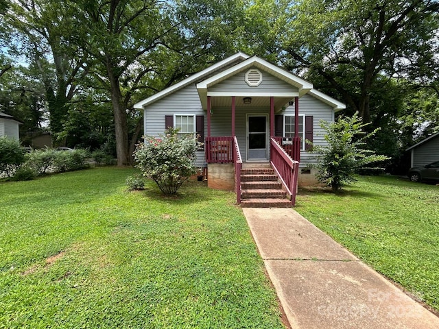 407 Alton St, Monroe, NC 28110 - bungalow-style house featuring covered porch, crawl space, and a front yard