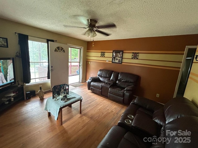 407 Alton St, Monroe, NC 28110 - living area with a textured ceiling, wood finished floors, and a ceiling fan