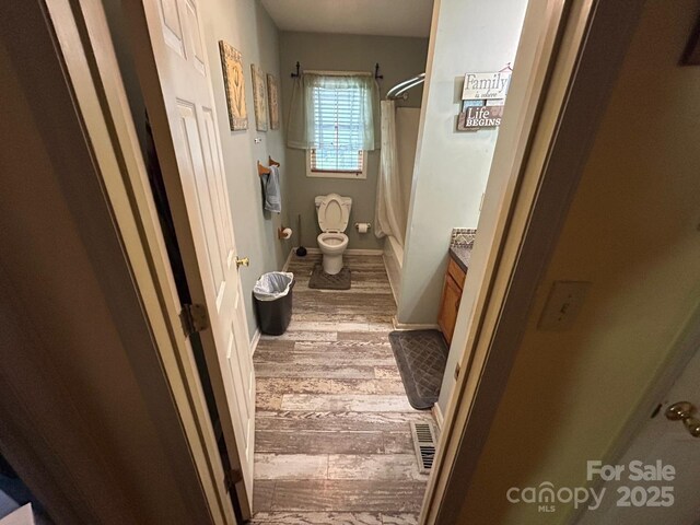 407 Alton St, Monroe, NC 28110 - full bath with vanity and wood finished floors