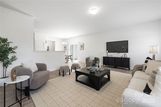 12548 Gotland Rd Unit 327, Midland, NC 28107 - living room featuring a chandelier and light wood finished floors
