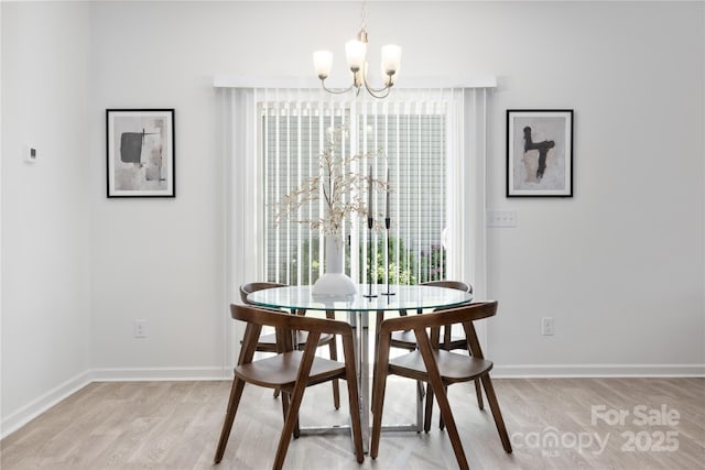 12548 Gotland Rd Unit 327, Midland, NC 28107 - dining room featuring a chandelier and light wood-style flooring